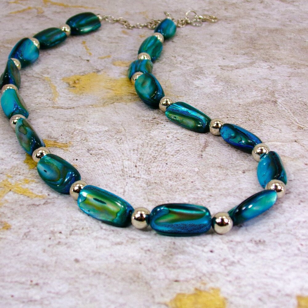 Blue shell bead necklace with long shell beads mixed with silver round beads